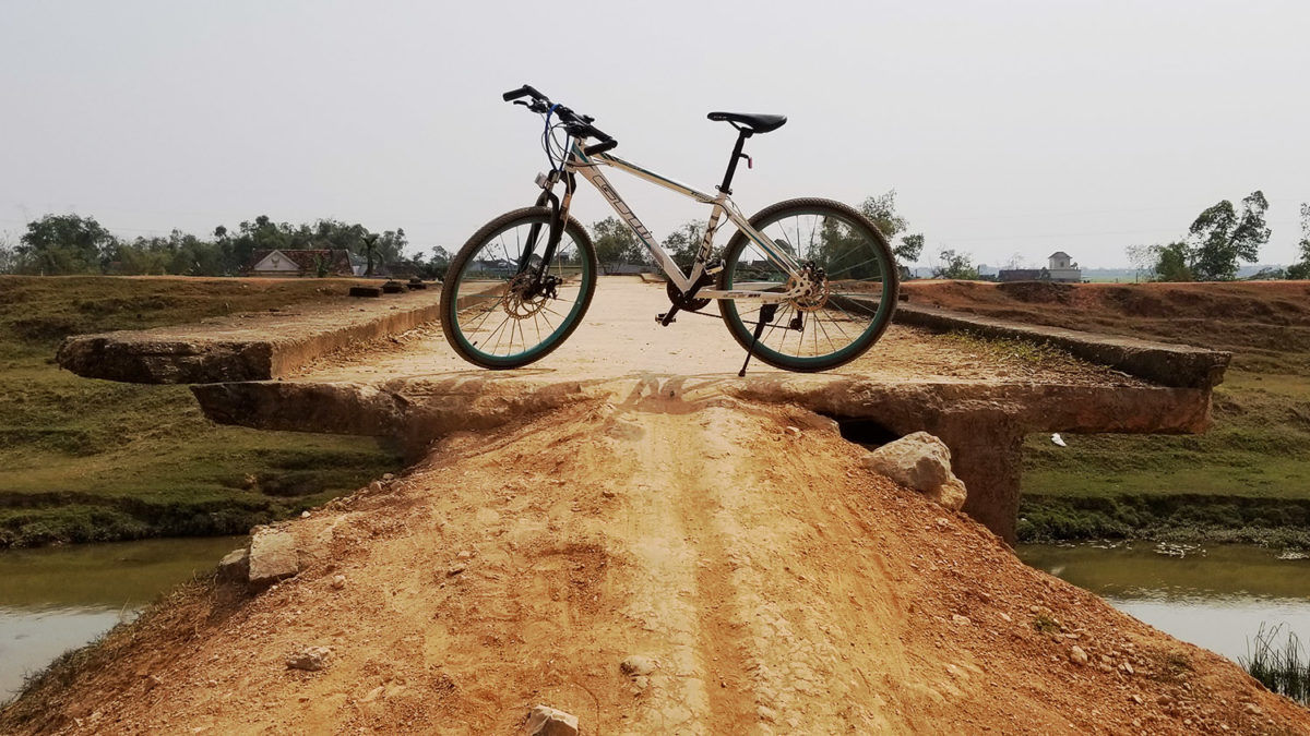 cycling vietnam countryside dangerous bridge