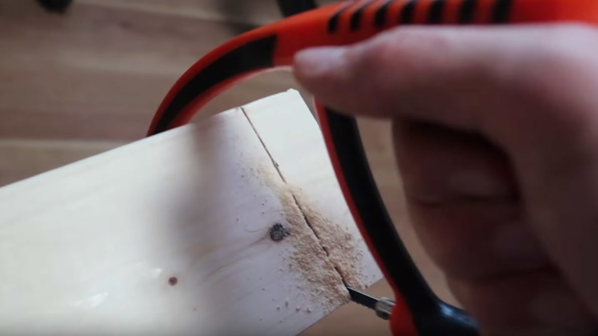 hand saw cutting wood