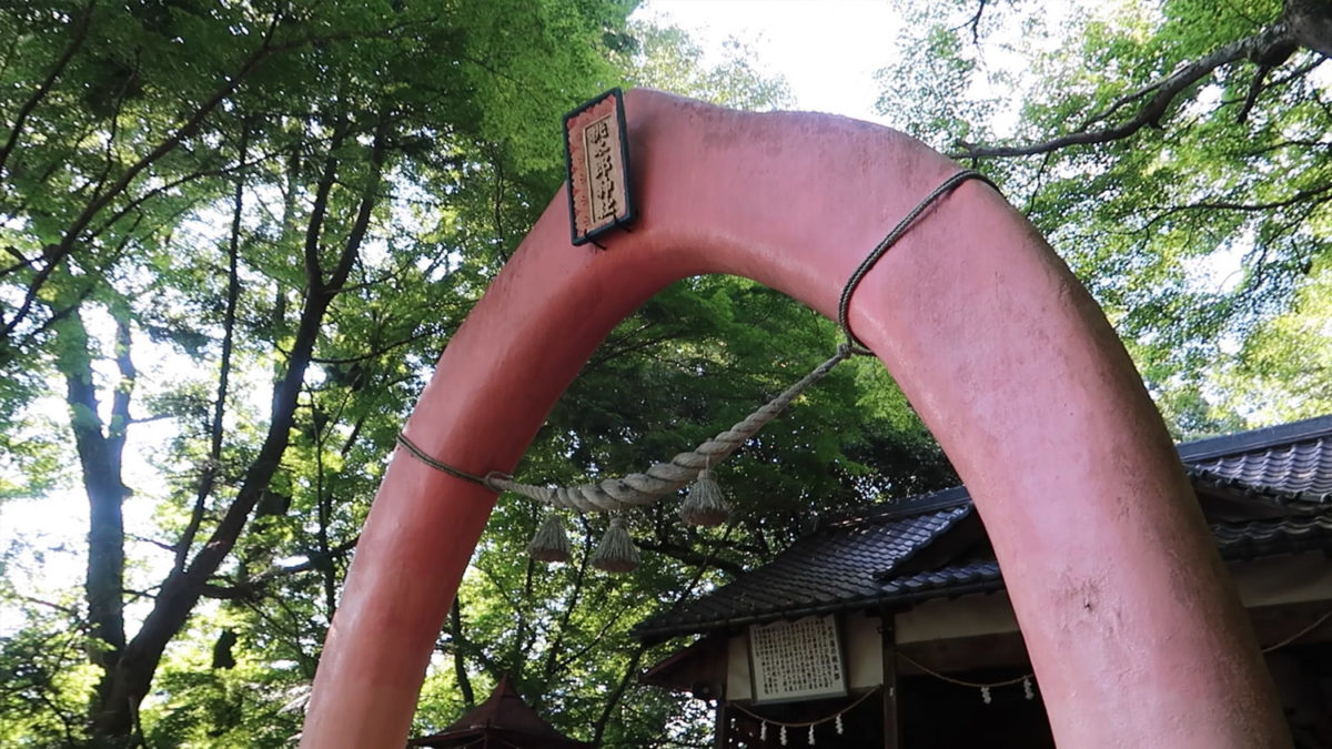 giant pink peach gate momotaro shrine