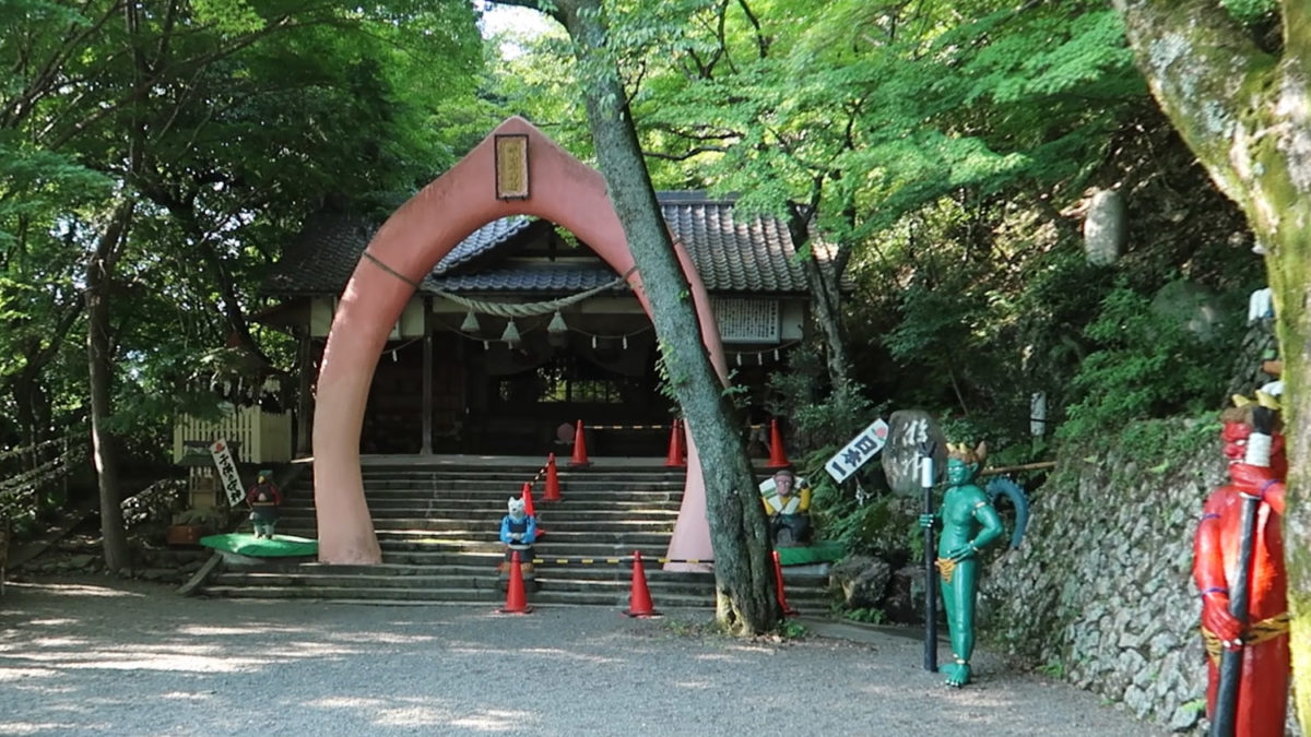 giant pink peach gate momotaro shrine summer