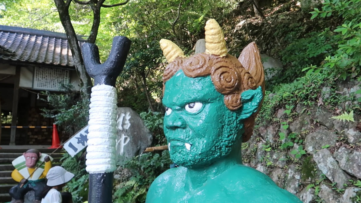 momotaro shrine green demon statue