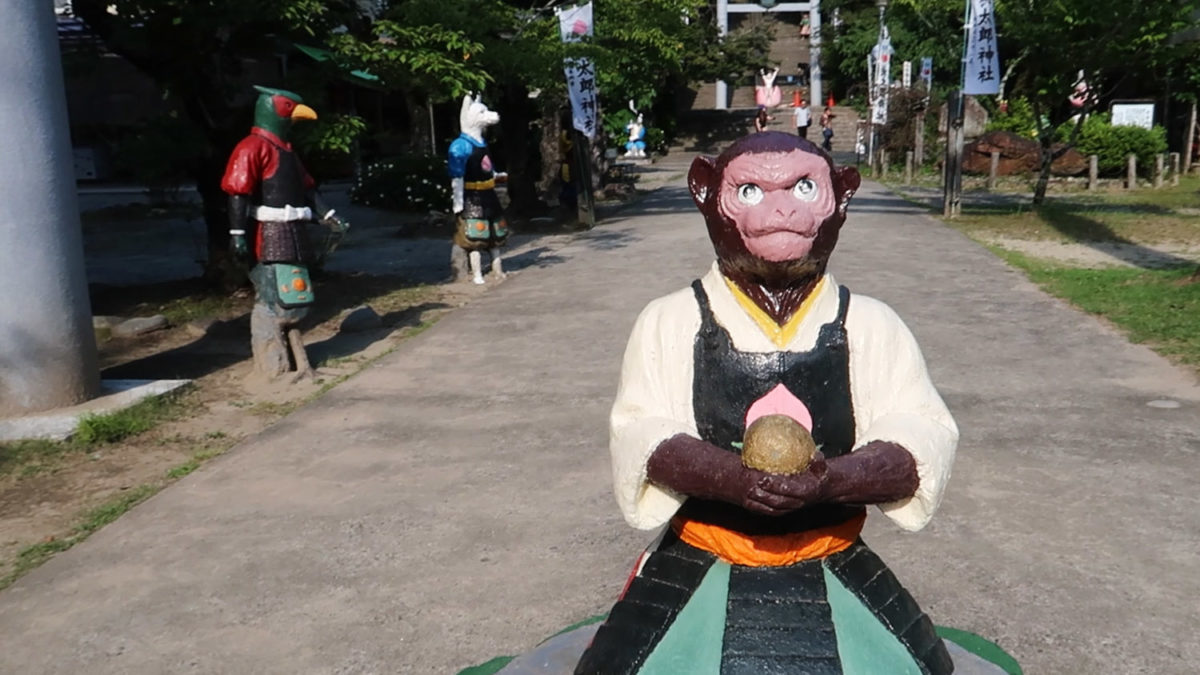 momotaro shrine monkey animal statue